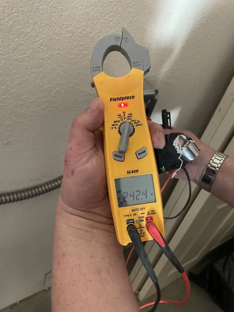 Voltage testing with clamp meter during Electrical Installation Services in Woodmore